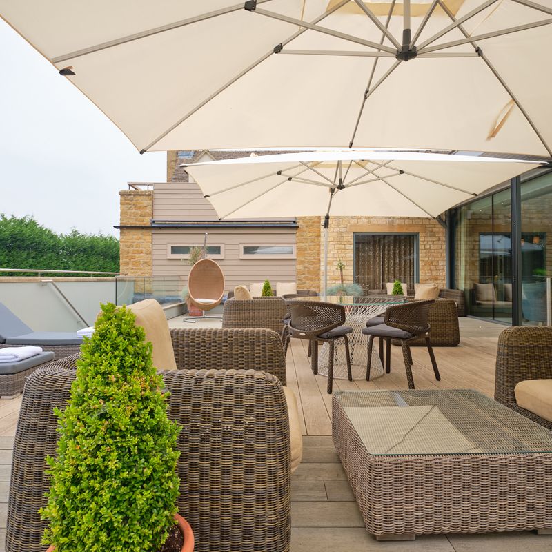 The Greenhouse spa café with floor-to-ceiling windows and outdoor sun terrace
