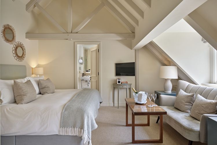 Splendid Room with elegant bespoke headboard and panoramic estate light