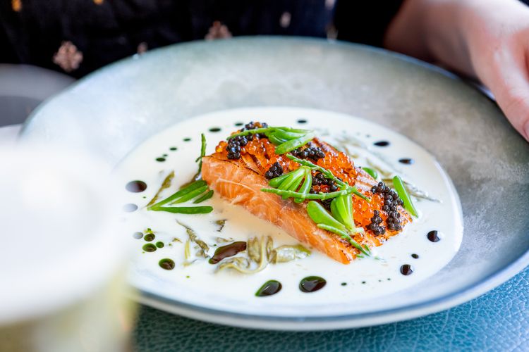 Artisan culinary plating at The Back Garden restaurant featuring rare-breed meats and fresh herbs